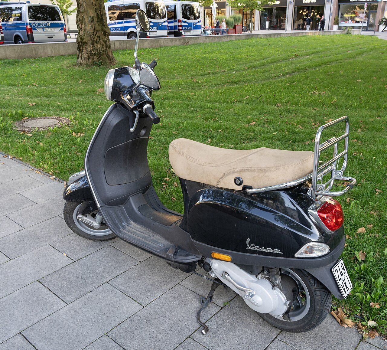 Piaggio Vespa scooter parked on a street in Munich